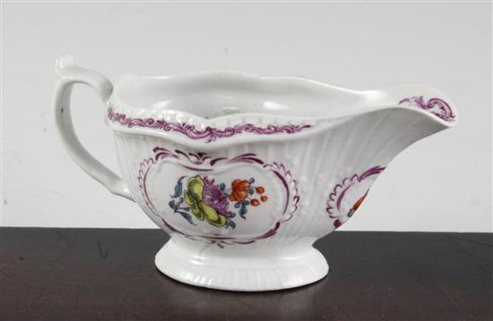 A Worcester polychrome sauceboat, c.1765-70, length 15.5cm